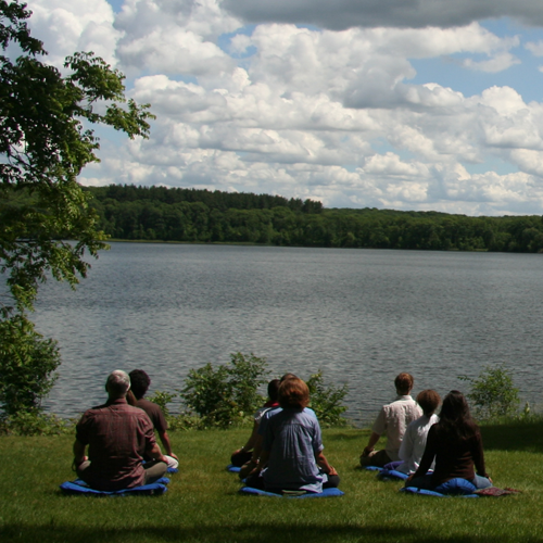 Meditators at lake